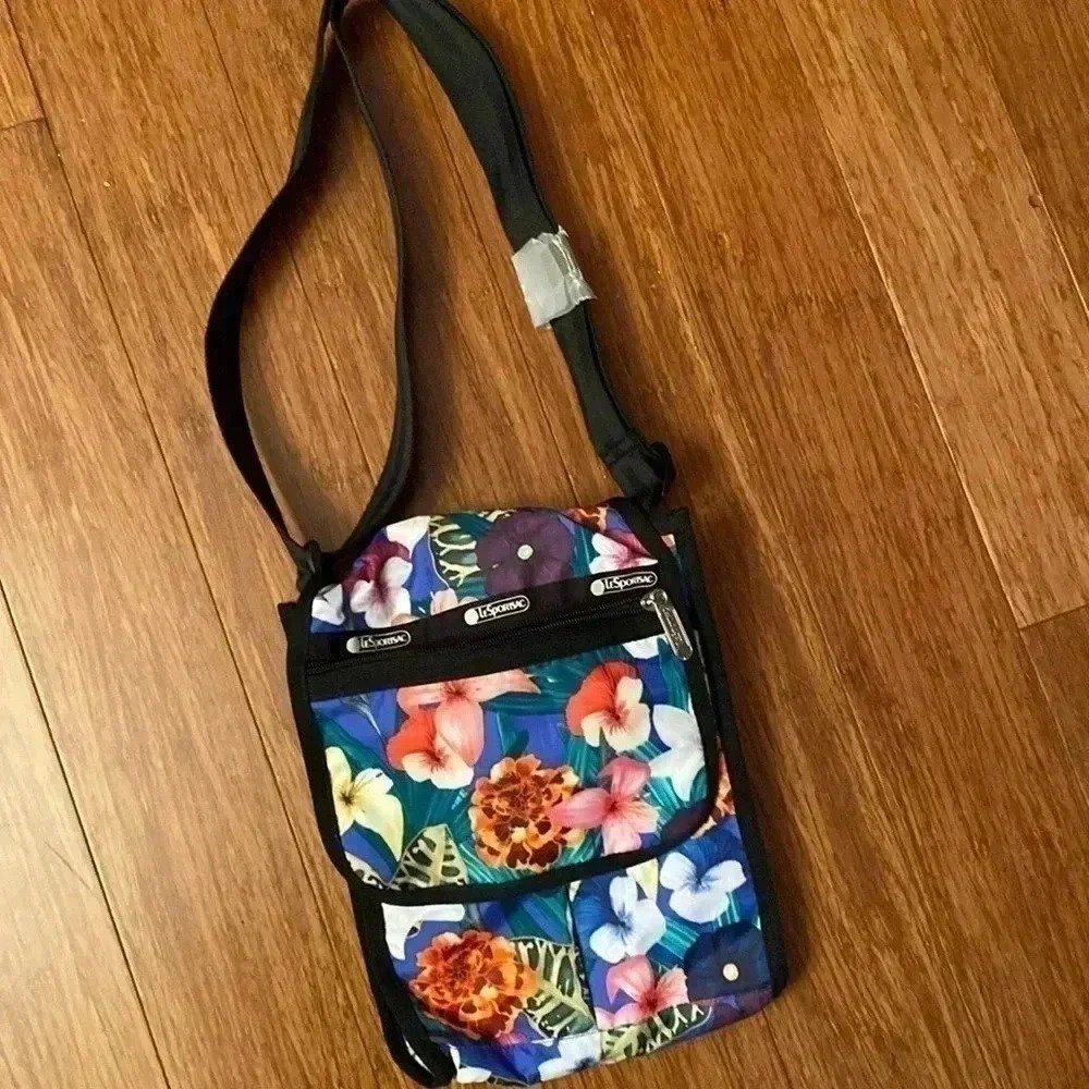 LeSportSac floral print cross body with adjustable strap and a lot of pockets